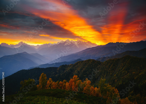 Fantastic brilliant sunrise with rays breaking through the clouds. Location place of  Upper Svaneti  Georgia country.