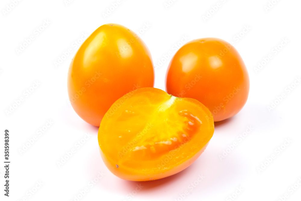 Yellow fresh tomatoes isolated on white background in close-up