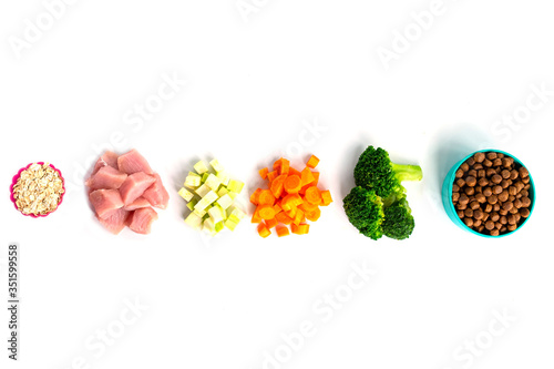 ingredients oat, meat, zucchini, broccoli, carrot for pet food natural on white background