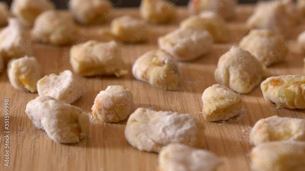 steady cam on the potato dumplings on the chopping board steady cam on the potato dumplings on the chopping board