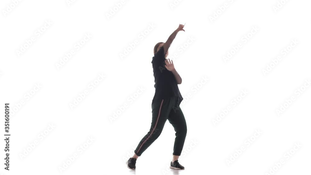 young beautiful woman dancer in tracksuit dancing hiphop, contemporary, modern street dance, isolated young beautiful woman dancer in tracksuit dancing hiphop, contemporary, modern street dance, isolated