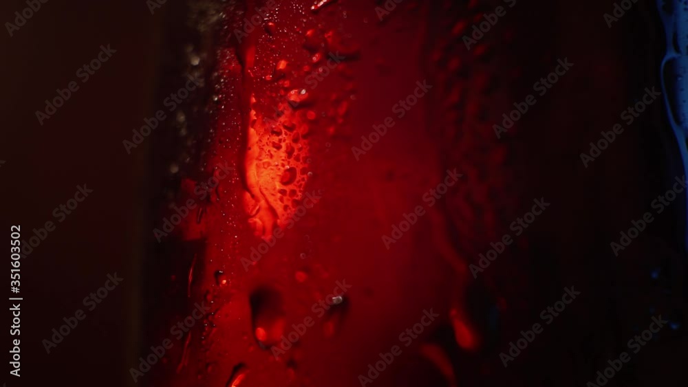 beautifully lit by a glass beaker filled with cola.closeup beautifully lit by a glass beaker filled with cola.closeup