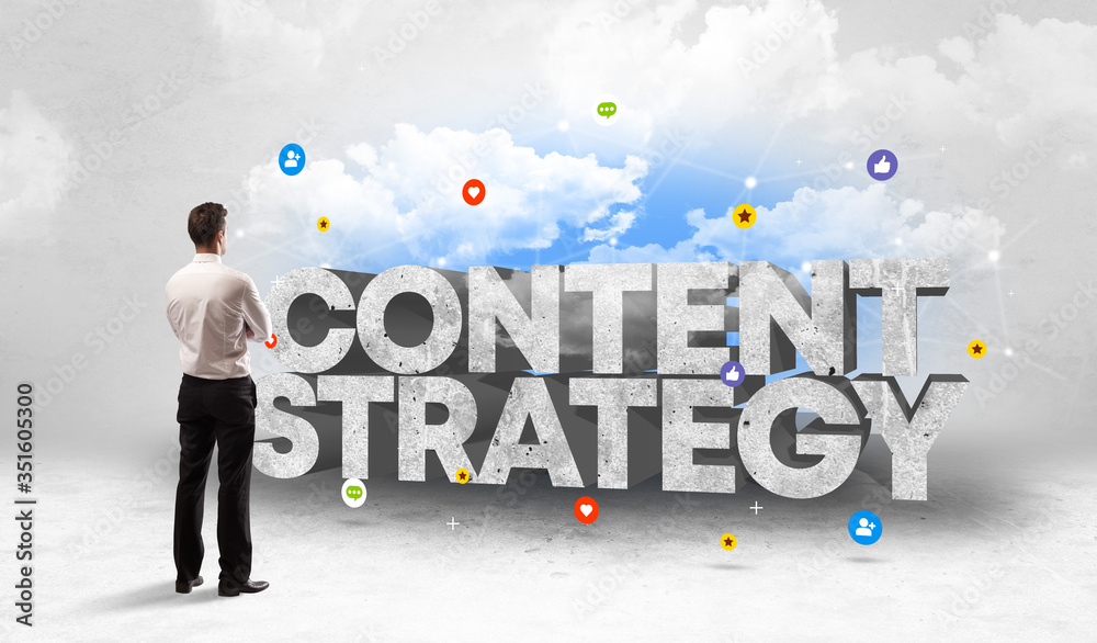 Young businessman standing in front of CONTENT STRATEGY inscription, social media concept Young businessman standing in front of CONTENT STRATEGY inscription, social media concept