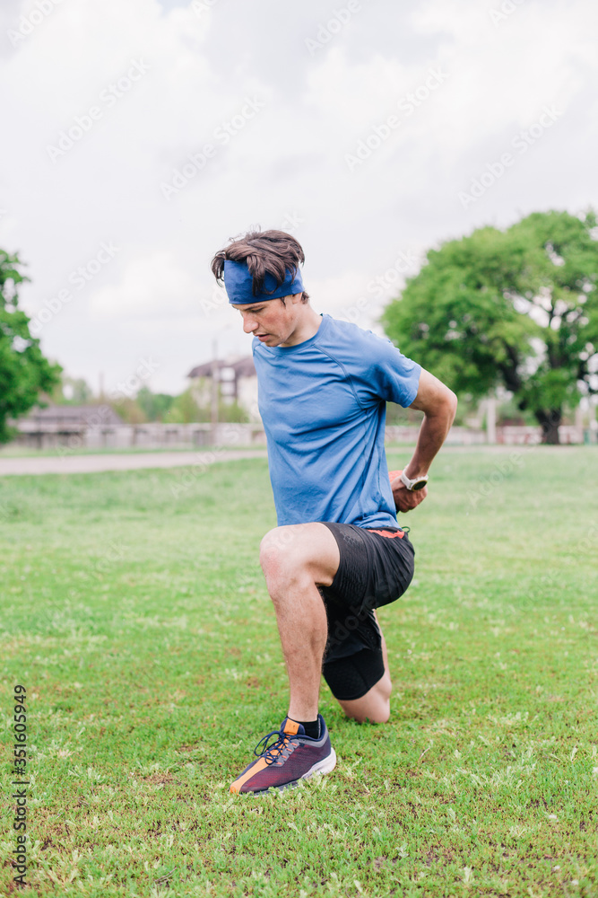 Athlete does warm-up before running at stadium Athlete does warm-up before running at stadium