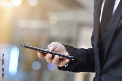 Close up of man using mobile smartphone. Business and technology concept.