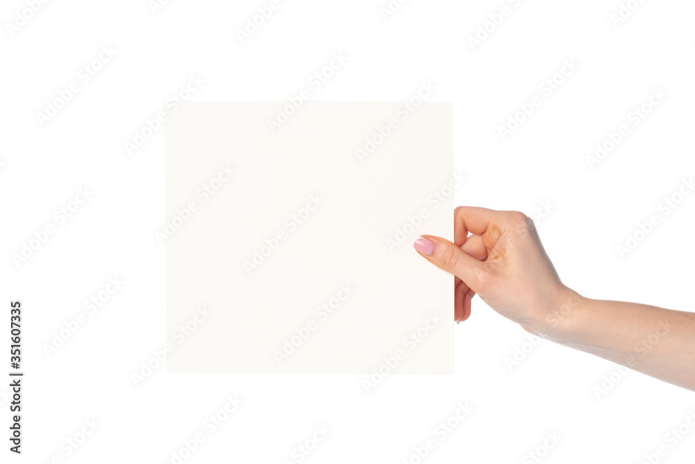 Woman's hand showing white paper banner isolated on white