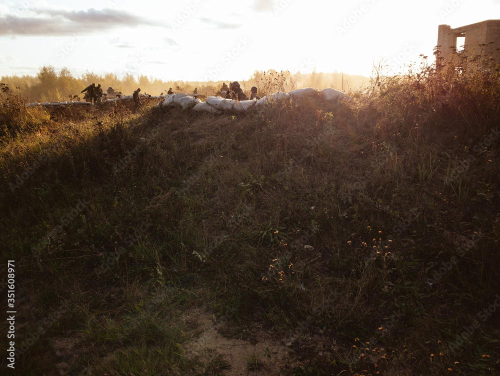 A group of soldiers. A group of soldiers in a combat position in the trenches.