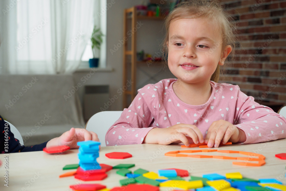 Cute little girl playing with constructor Cute little girl playing with constructor