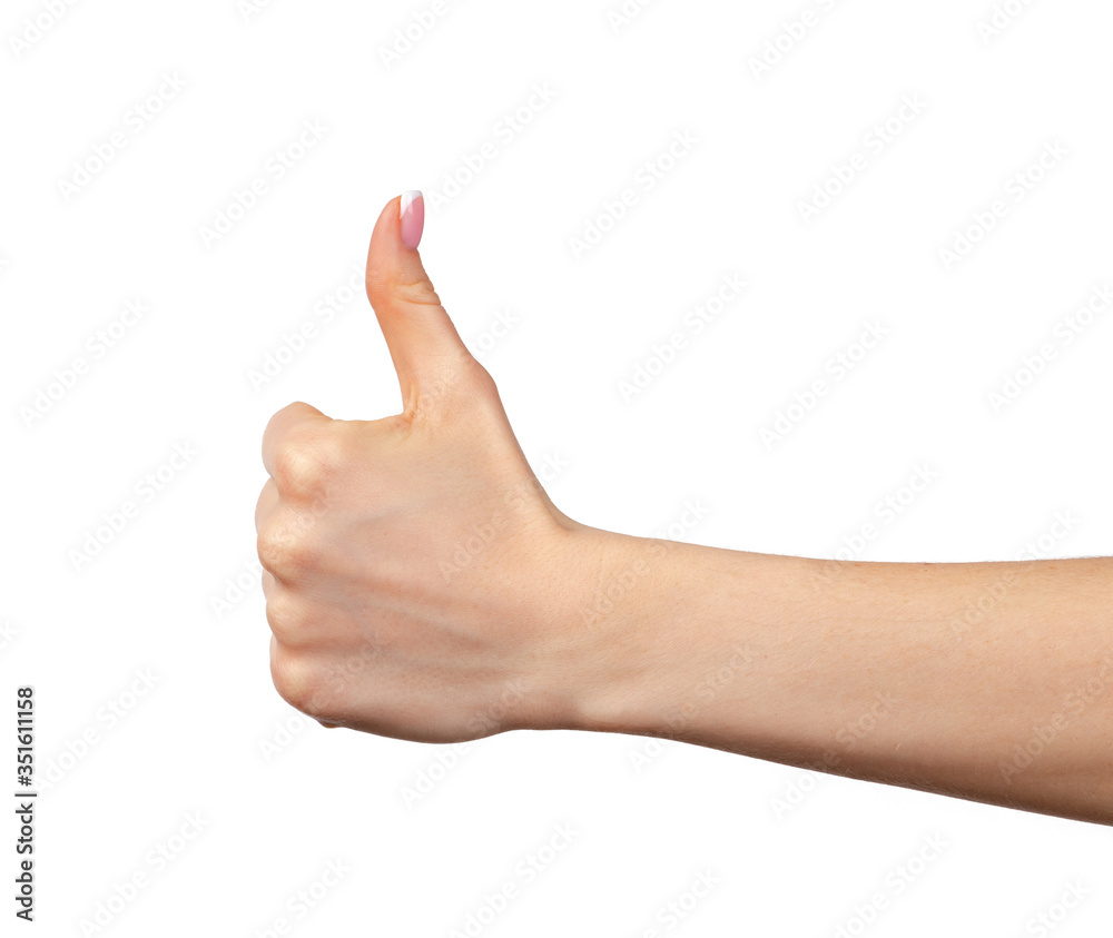 Female hand showing thumb up sign isolated on white. Female hand showing thumb up sign isolated on white.