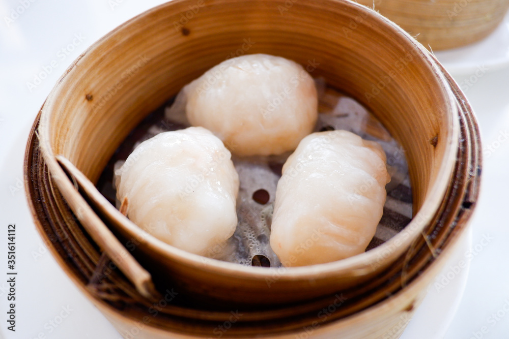 Chinese dumpling in a bamboo steamer box Chinese dumpling in a bamboo steamer box