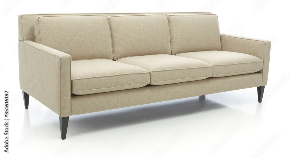 Classic formal sofa for three seats, isolated.Three seats cozy color fabric sofa isolated on white.