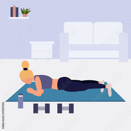 Woman doing plank position. Workout at home during quarantine. 