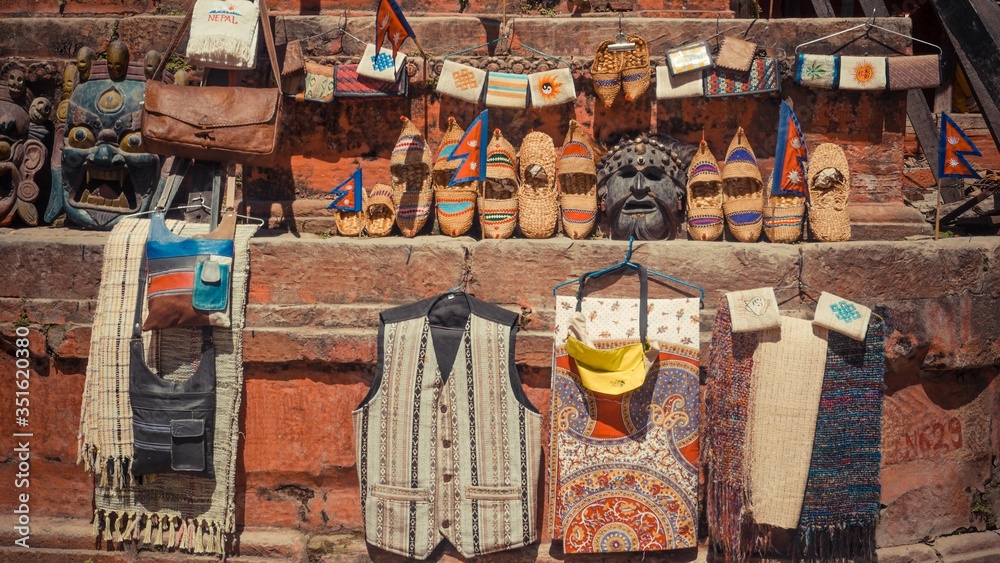 Well organised shoes with mask and hanging clothes