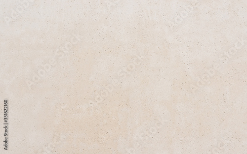 Clean concrete wall texture, beige background photo