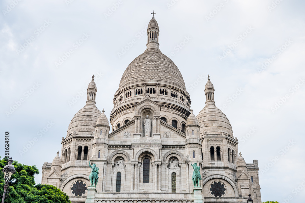 The Basilica of the Sacred Heart of Paris, at the summit of the butte Montmartre, the highest point in Paris, France