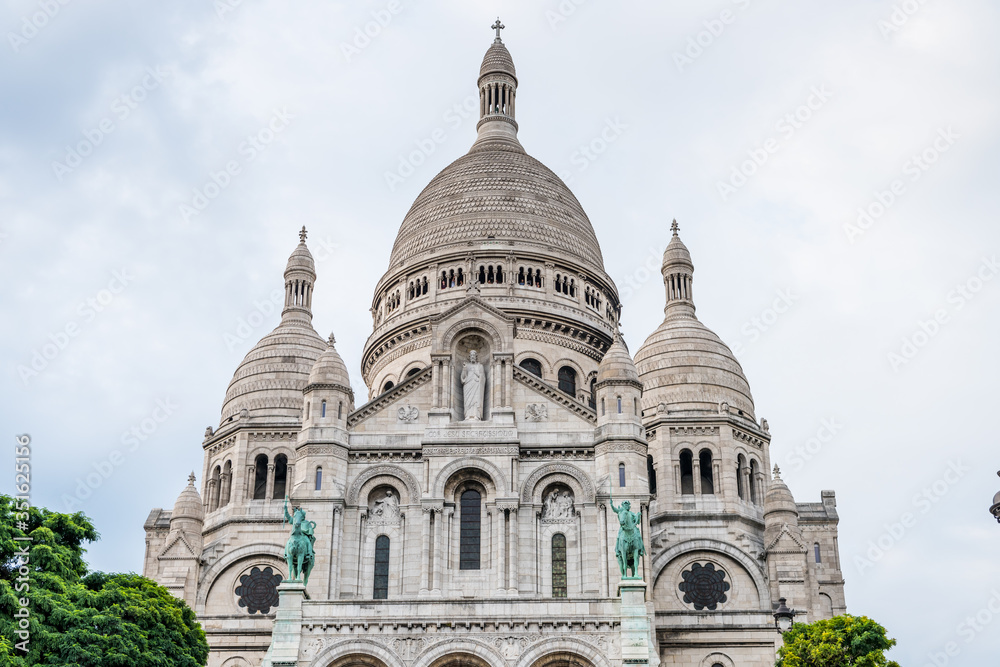 The Basilica of the Sacred Heart of Paris, at the summit of the butte Montmartre, the highest point in Paris, France