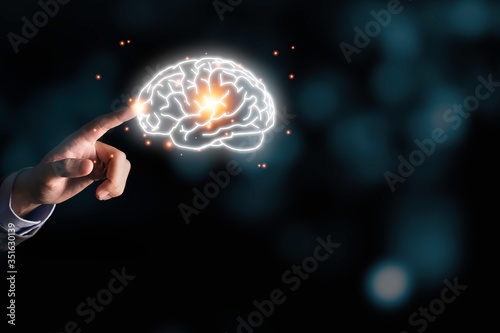 Wallpaper Mural Businessman holding the blue virtual brain. Creative new business idea concept. Torontodigital.ca