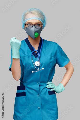 female doctor with stethoscope wearing protective mask and latex gloves over light grey background