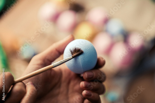 close up of a woman holding a brush