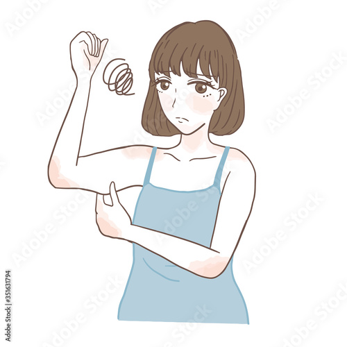 二の腕を気にする女性