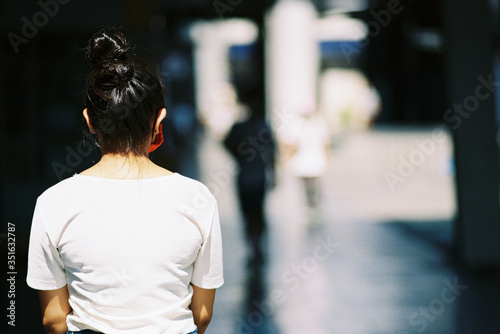 Sad asian female don mask candidate job back view from walkway and sad unemployed outside office in the dark corner Depression with anxiety stressed and lonely. Film camera look photo noise and grain