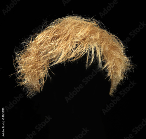 Short blonde hair wig isolated on black background