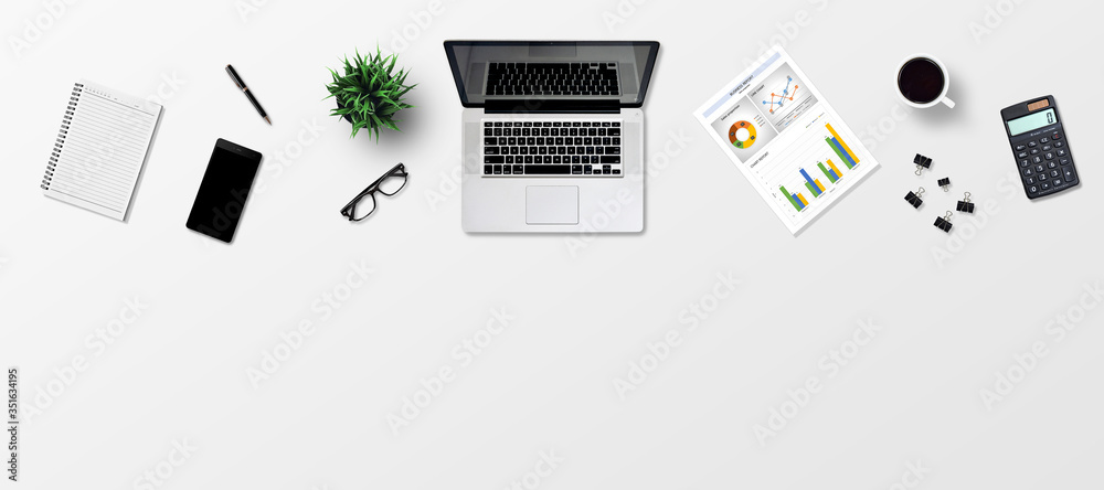 Top view office desk and supplies, with copy space. Creative flat lay photo of workspace desk/Panoramic banner gray background Top view office desk and supplies, with copy space. Creative flat lay photo of workspace desk/Panoramic banner gray background