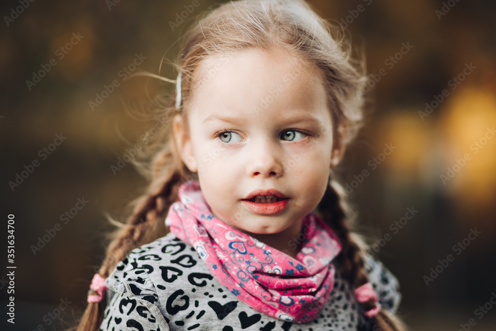 Handsome caucasian child in warm clothes looks aside Handsome caucasian child in warm clothes looks aside