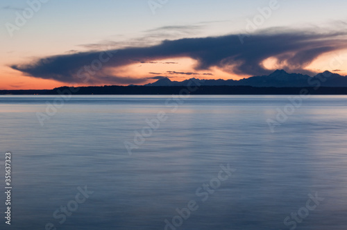 Evening Olympic park mountain silhouette, evening sea and clouds in Picnic Point area, WA, USA © Maksym