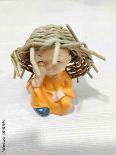 Small Buddha Statue Monk With Straw Hat Resin