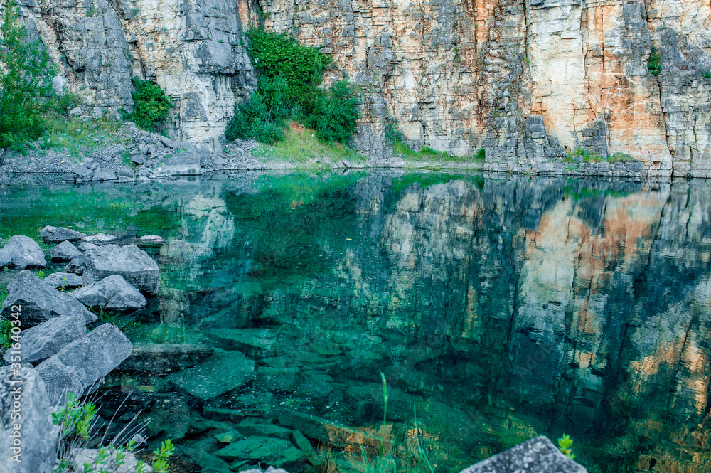 stone sediments forming a natural rive with crystal clear water around it Ansiao- Portugal
