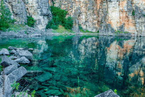 stone sediments forming a natural rive with crystal clear water around it Ansiao- Portugal