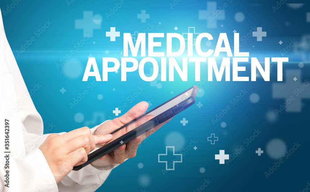 doctor writes notes on the clipboard with MEDICAL APPOINTMENT inscription, first aid concept doctor writes notes on the clipboard with MEDICAL APPOINTMENT inscription, first aid concept