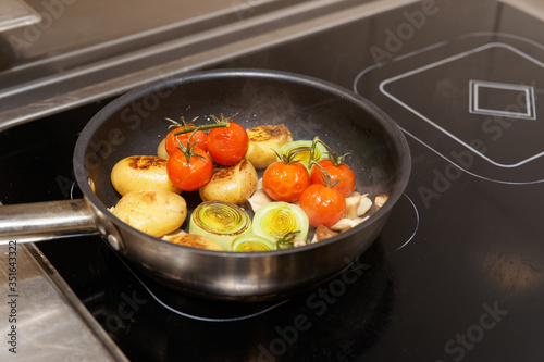 Frying vegetables in pan