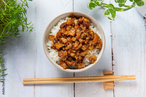 braised pork on rice is Minced pork served with pickles on top of steamed rice