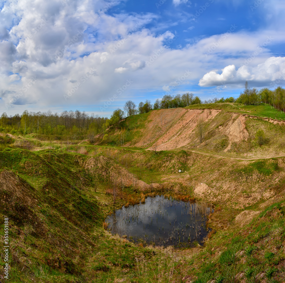 Fototapeta premium Spring landscape of a closed sand pit.