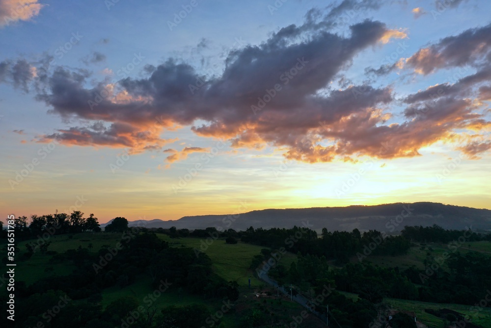 Aerial view of dramatic sky in the ranch. Rural life scene. Countryside landscape. 