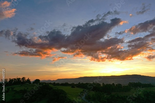 Aerial view of dramatic sky in the ranch. Rural life scene. Countryside landscape. 