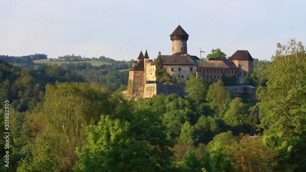Old Castle in forest during sunset