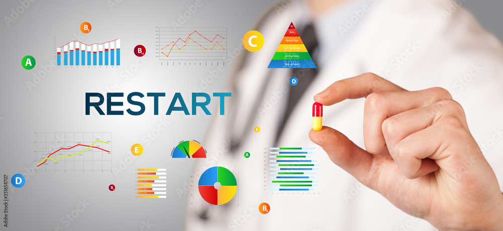 Nutritionist giving you a pill with RESTART inscription, healthy lifestyle concept Nutritionist giving you a pill with RESTART inscription, healthy lifestyle concept