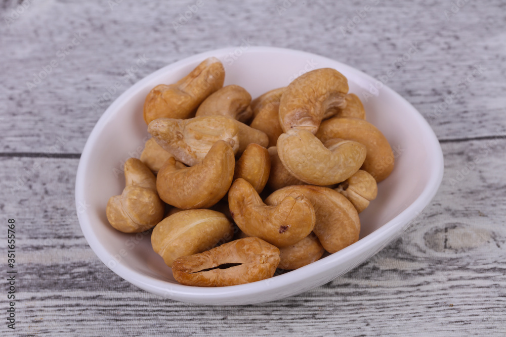 Cashew nuts heap in the bowl Cashew nuts heap in the bowl