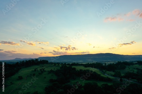 Aerial view of dramatic sky in the ranch. Rural life scene. Countryside landscape.  © ByDroneVideos