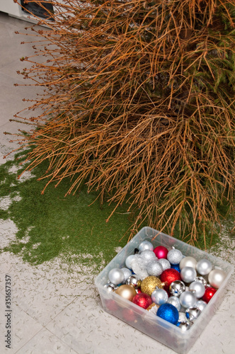 Christmas is over, fallen needles of Xmas tree on the floor photo