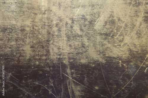 texture of the surface of the brass leaf, in scratches, background