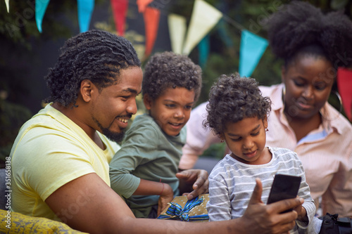 afro-american family at birthday party have fun and making selfie.