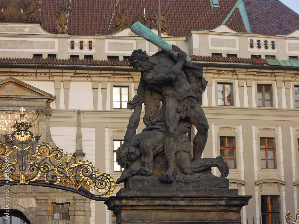 Sculpture from Gates of Wrestling Titans also known as Fighting Giants or Giants Gate, near entrance to Prague Castle, Czech Republic. Figure symbolizes gladiator going to make final strike to enemy