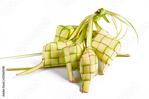 Ketupat isolated on white background. a typical dish made from rice wrapped in wrappers made from plaited young coconut leaves.