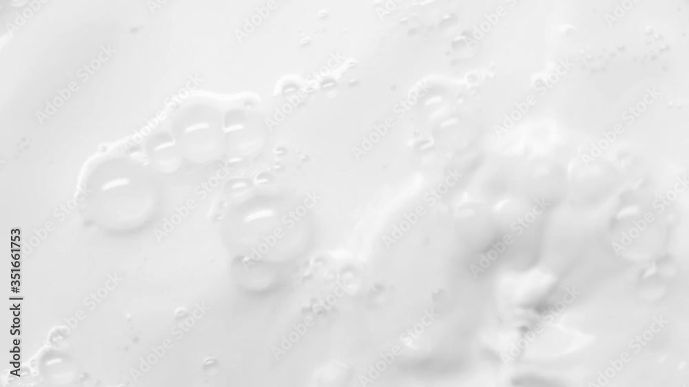 Pouring fresh milk in slow motion. A stream of milk pours down creating splashes and waves. Close-up pouring milk in Slow Motion with crown splash. Pouring fresh milk in slow motion. A stream of milk pours down creating splashes and waves. Close-up pouring milk in Slow Motion with crown splash.