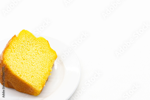 Closeup piece of sweet lemon cake served on white plate,Copy space.