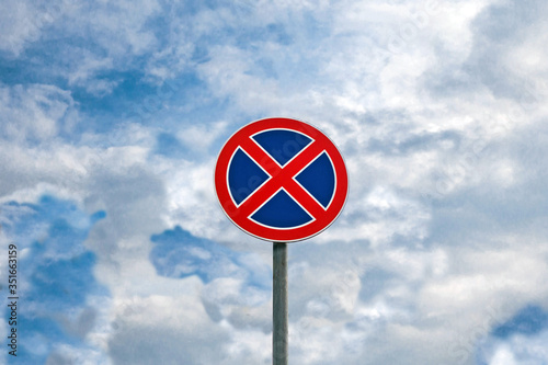 International traffic signs 'No parking' or 'No stopping' on blue sky background
